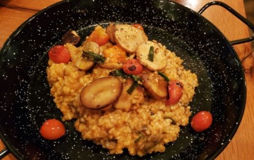 Paella with confit mushroom, saffron tomato rice, and seaweed