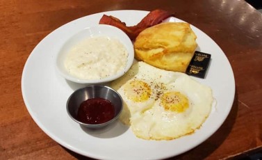 Egg Plate: 2 eggs any style, cheese grits, biscuit, jam, and choice of bacon or sausage