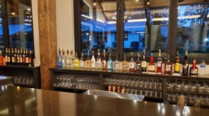 Bar serving up drinks, including cocktails