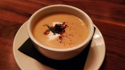 Cream of Pumkin Soup with Creme Fresh finished with a molasses drizzle