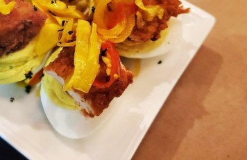 Chicken on the Egg: 4 scallion-curry deviled eggs, each topped with a crispy, southern fried chicky nuggie, and house-made rainbow pepper chow chow.
