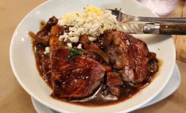 Beef Filet Medallions: 2.3oz seasoned & grilled angus beef filets served over creamy & rich 3 cheese polenta, smothered in garlic & thyme roasted mushroom demi glace, and topped with crumbled danish blue cheese.