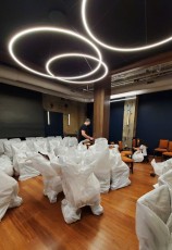 Unwrapping lots & lots of new chairs.