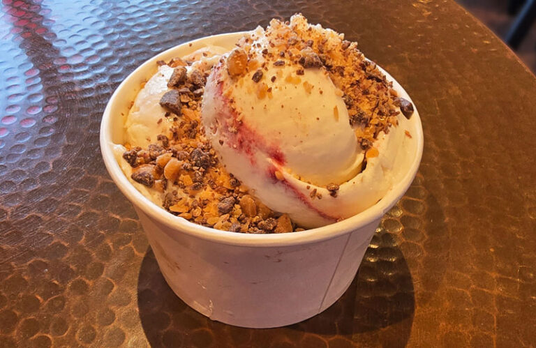 Medium cup of seasonal Cherry Amaretto ice cream topped with Heath Bar bits